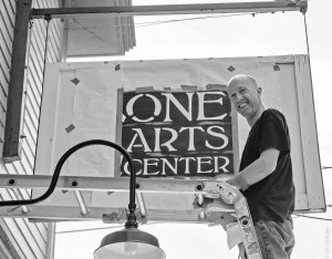 Luke prepares to spray paint the sign